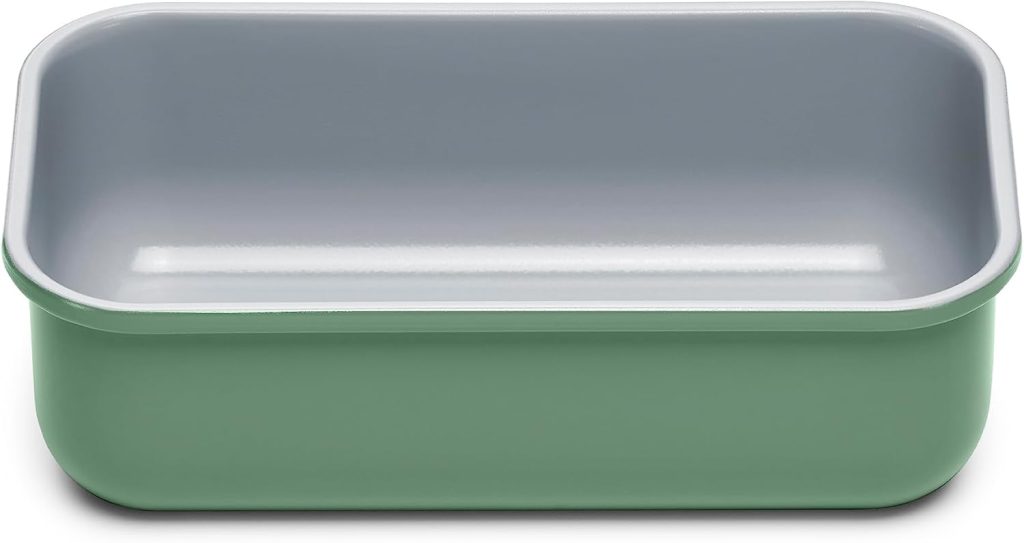 A rectangular green and gray plastic tray with rounded corners, reminiscent of the perfect dish to serve pumpkin banana bread, empty and viewed from above.