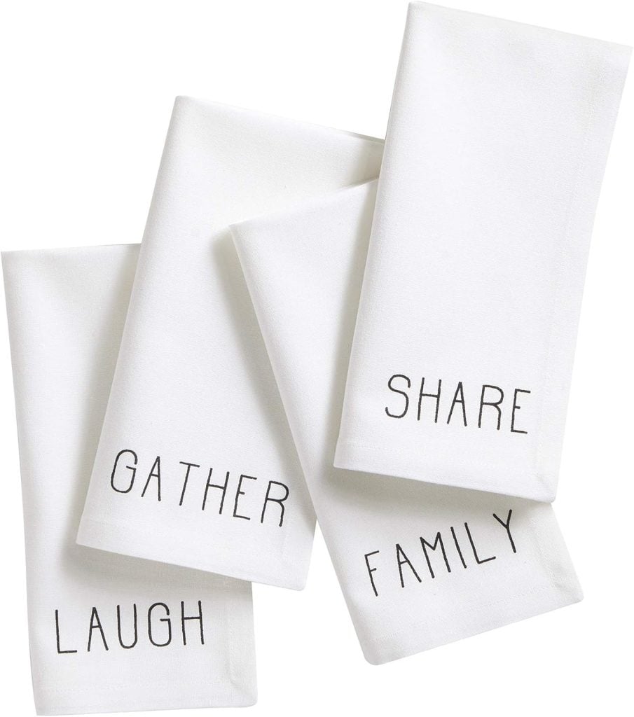 Four white napkins with black text: "GATHER," "SHARE," "LAUGH," and "FAMILY" - perfect companions for cozy fall soup recipes.