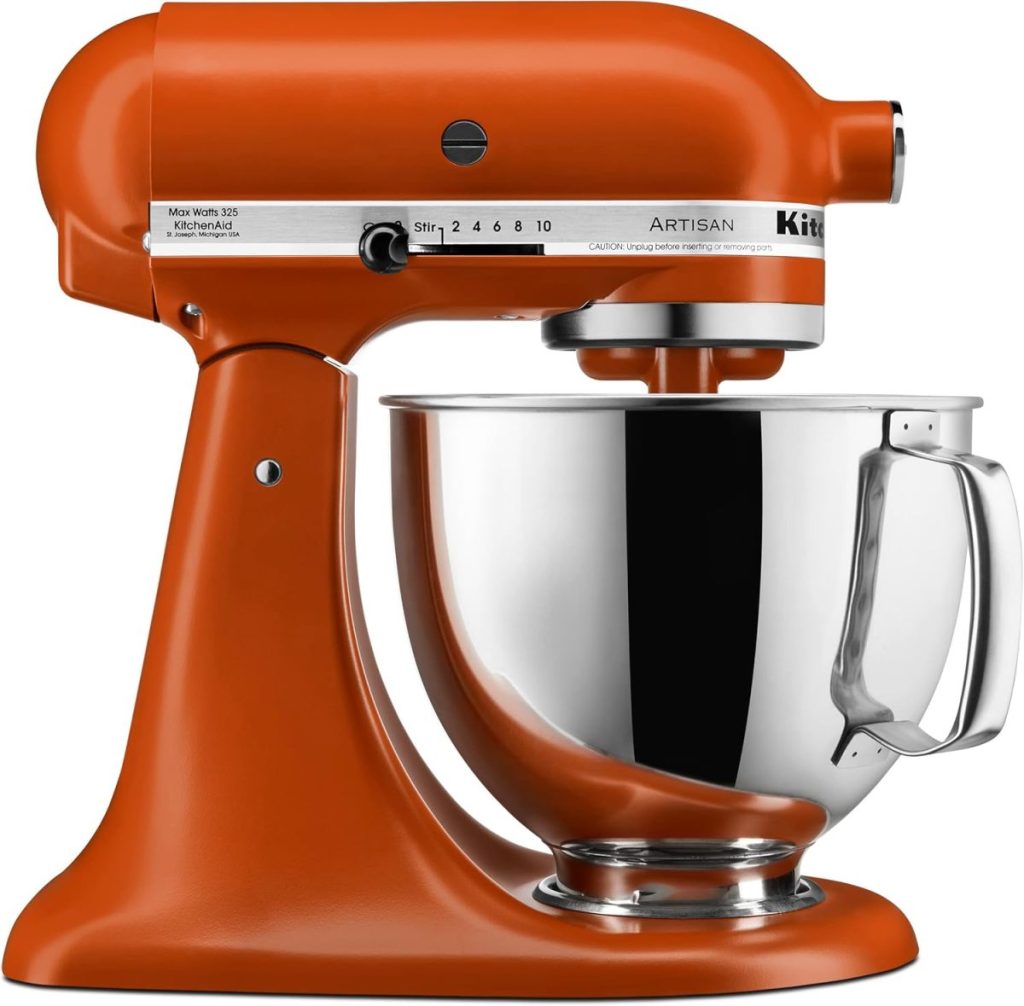 An orange stand mixer with a stainless steel mixing bowl attached, perfect for whipping up Halloween Sugar Cookies, featuring control settings from 1 to 10 on the side.