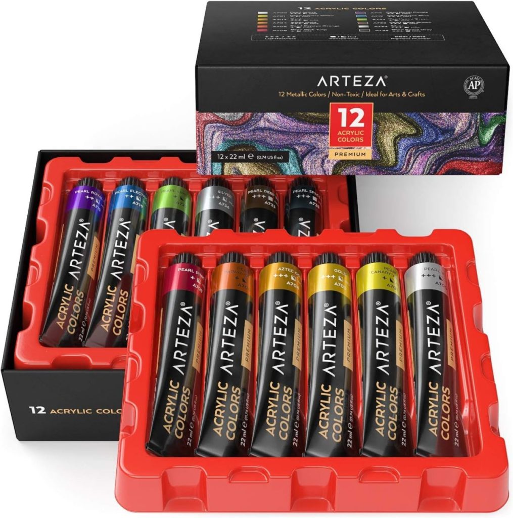 Set of 12 Arteza metallic acrylic paint tubes in a box with vibrant colors displayed, perfect for arts and crafts. These paints can add a unique touch to your projects, complementing the cozy aesthetic of fall pillows.