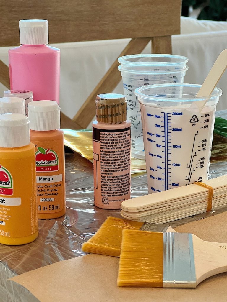 Crafting supplies including paint and brushes.