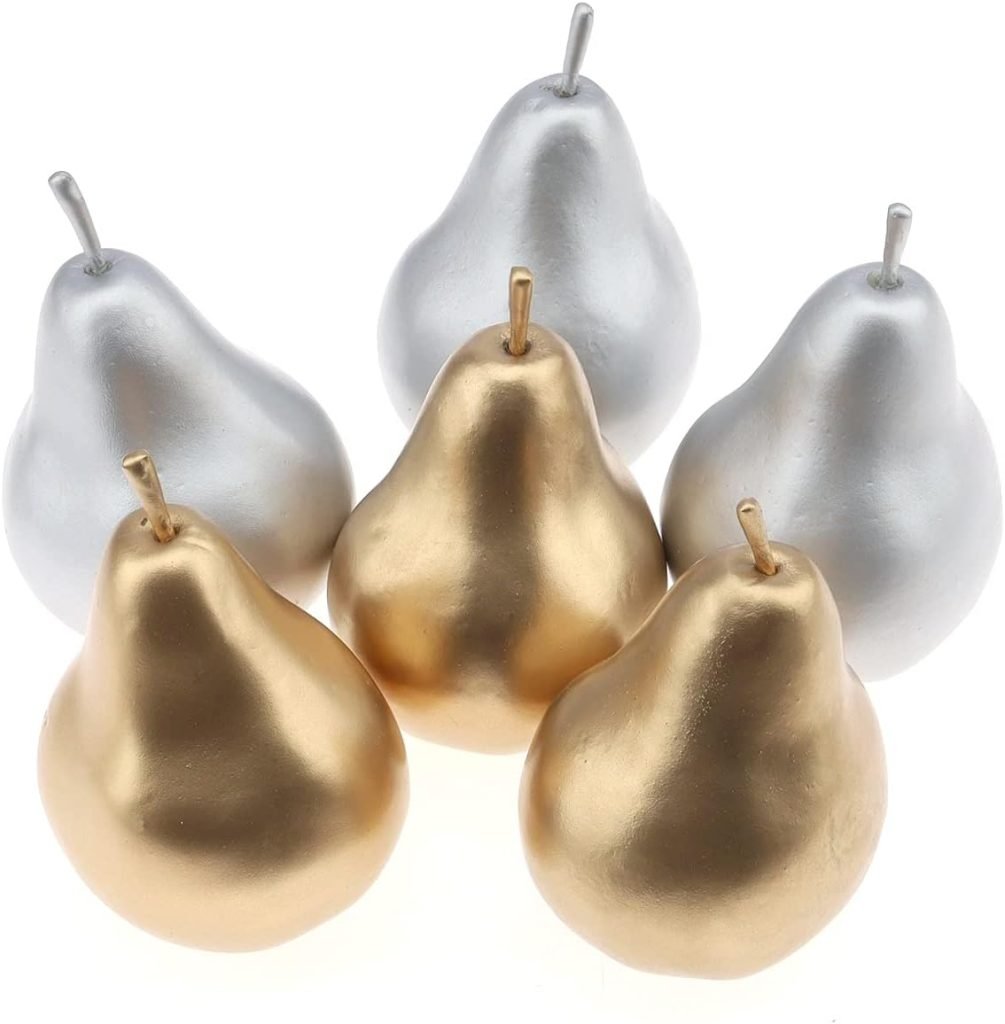 Five metallic decorative pears, three gold and two silver, arranged in a triangular pattern to elegantly set a Christmas table.