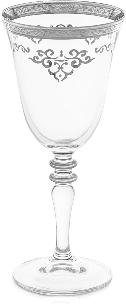 A clear wine glass adorned with decorative silver patterns on the bowl and a faceted stem, perfect for setting a festive Christmas table.