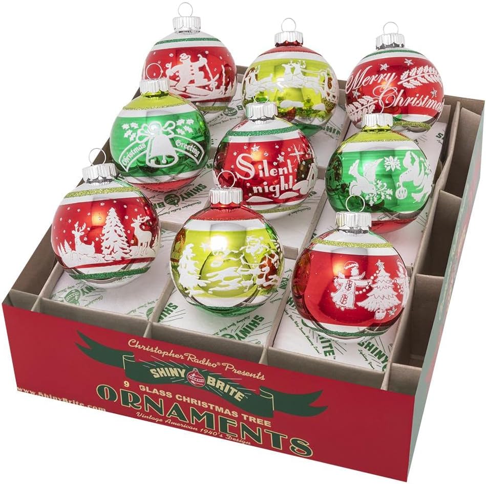 A box of nine vintage Christmas ornaments in red, green, and gold, adorned with festive designs and phrases like "Merry Christmas" and "Silent Night," captures a timeless charm.