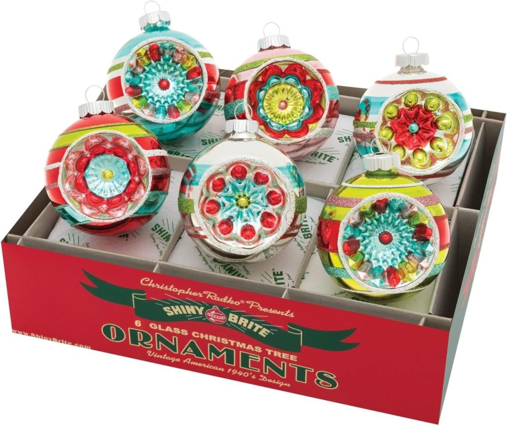 A box of six exquisite vintage Christmas ornaments, capturing the 1940s style with vibrant designs in red, green, and blue glass.