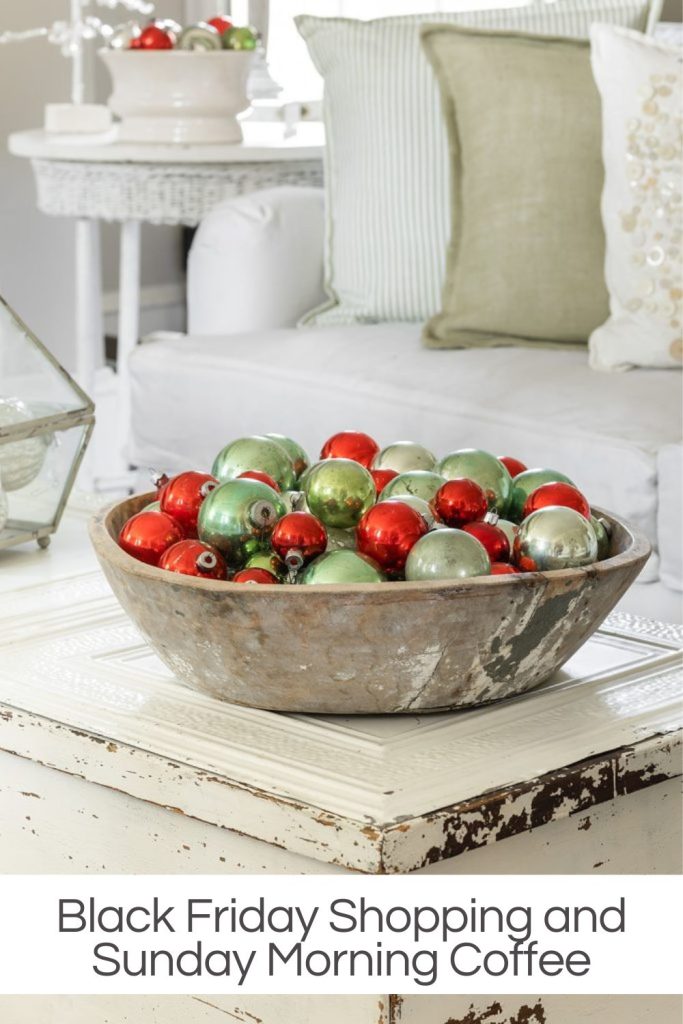 Green and red vintage ornaments in a wood bowl on the coffee table.