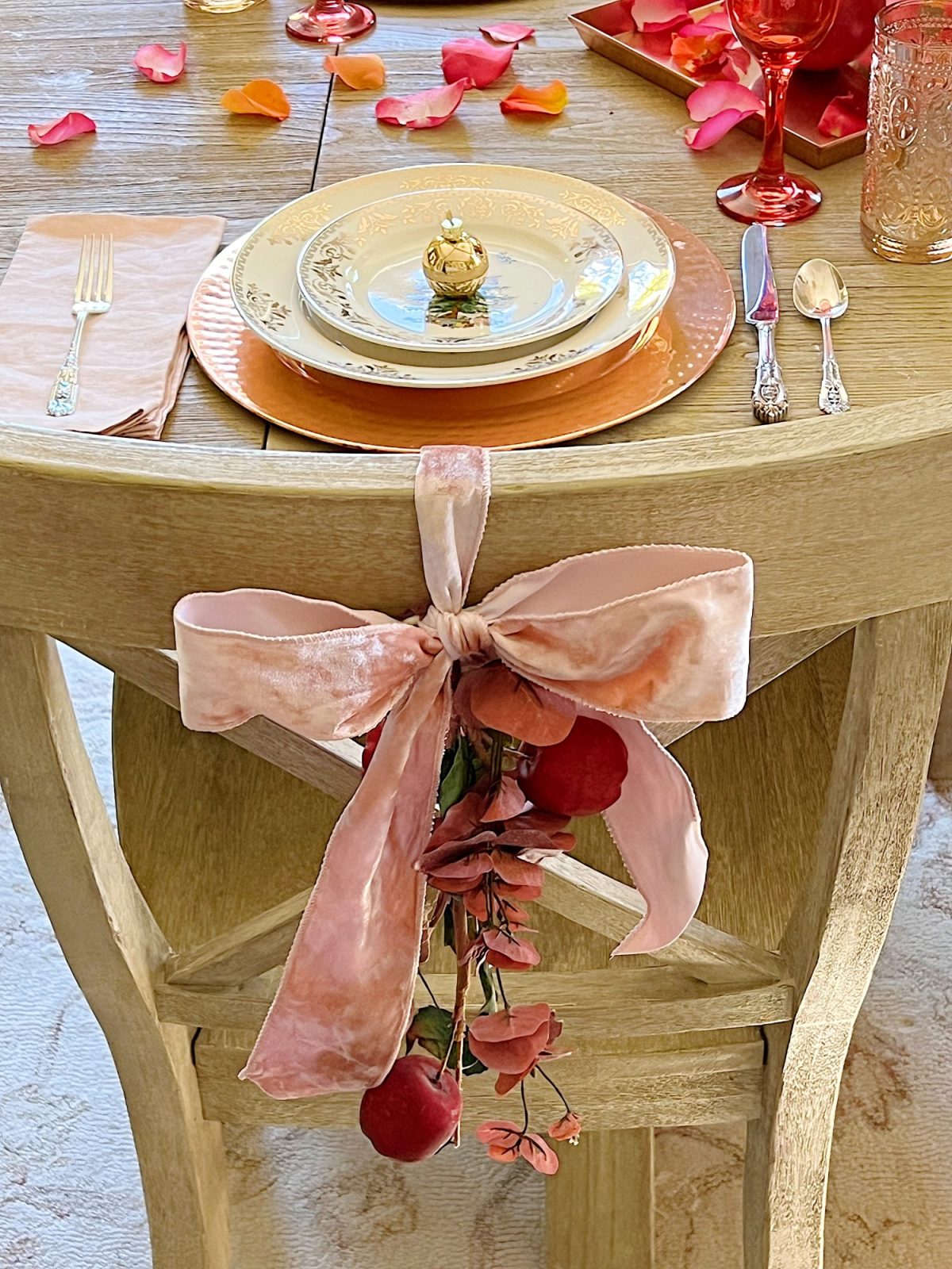 Tying a bow on the back of a dining room chair.