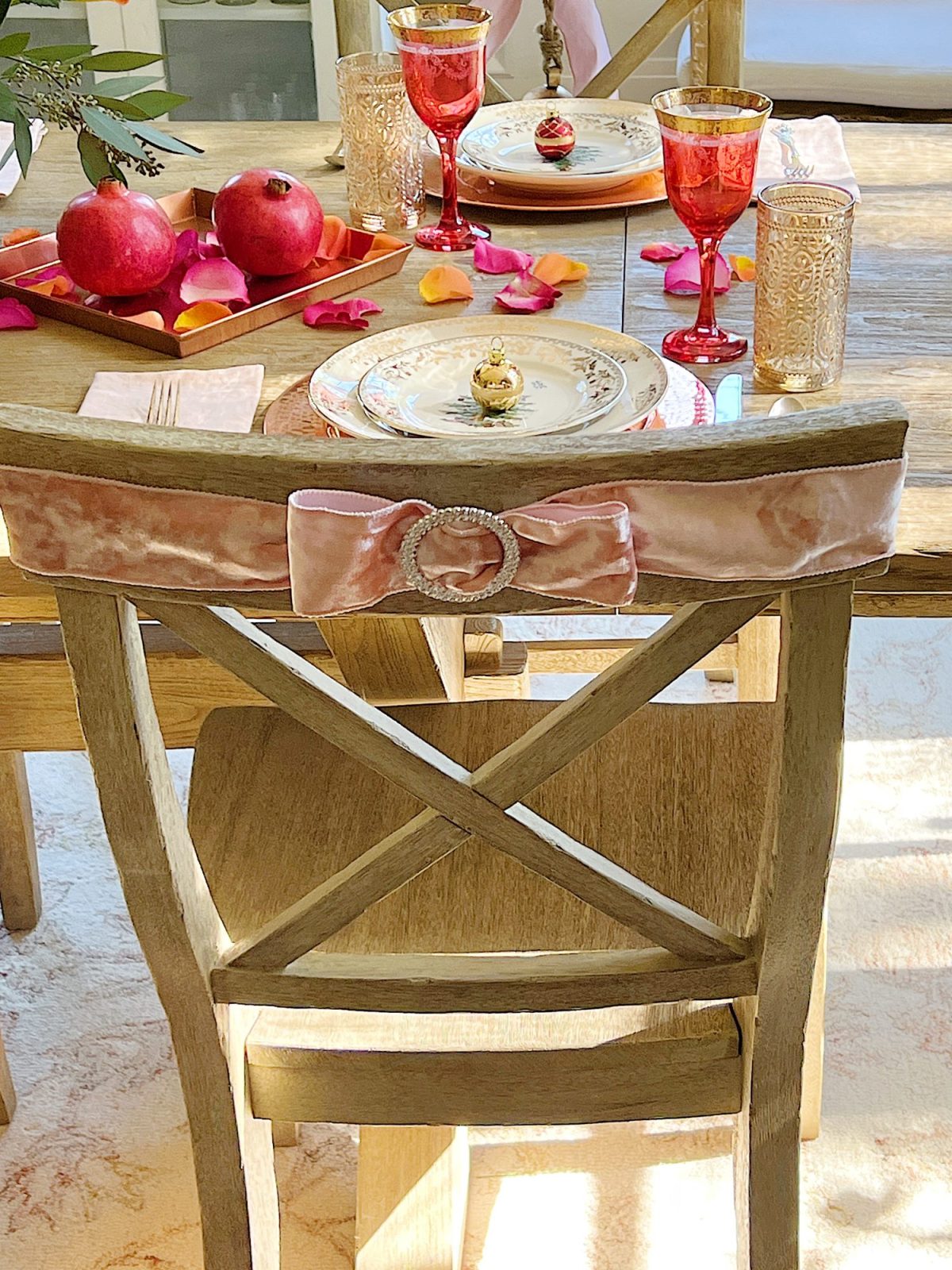Tying a bow on the back of a dining room chair.