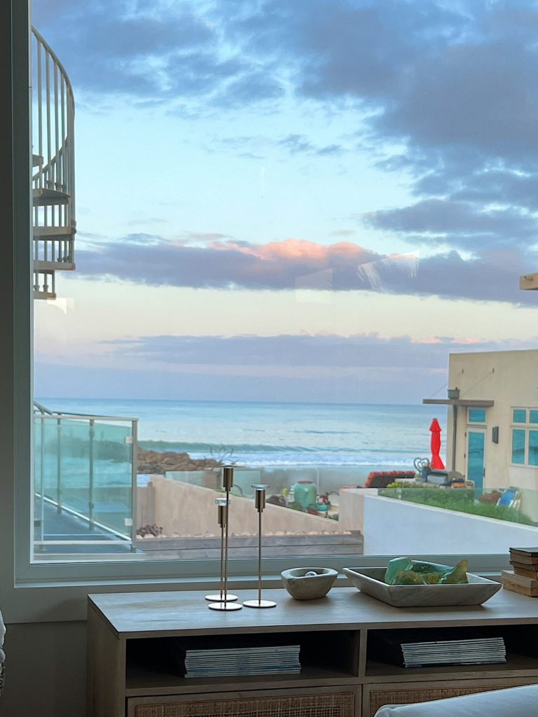 The large picture window at our beach house with an amazing view of the ocean.