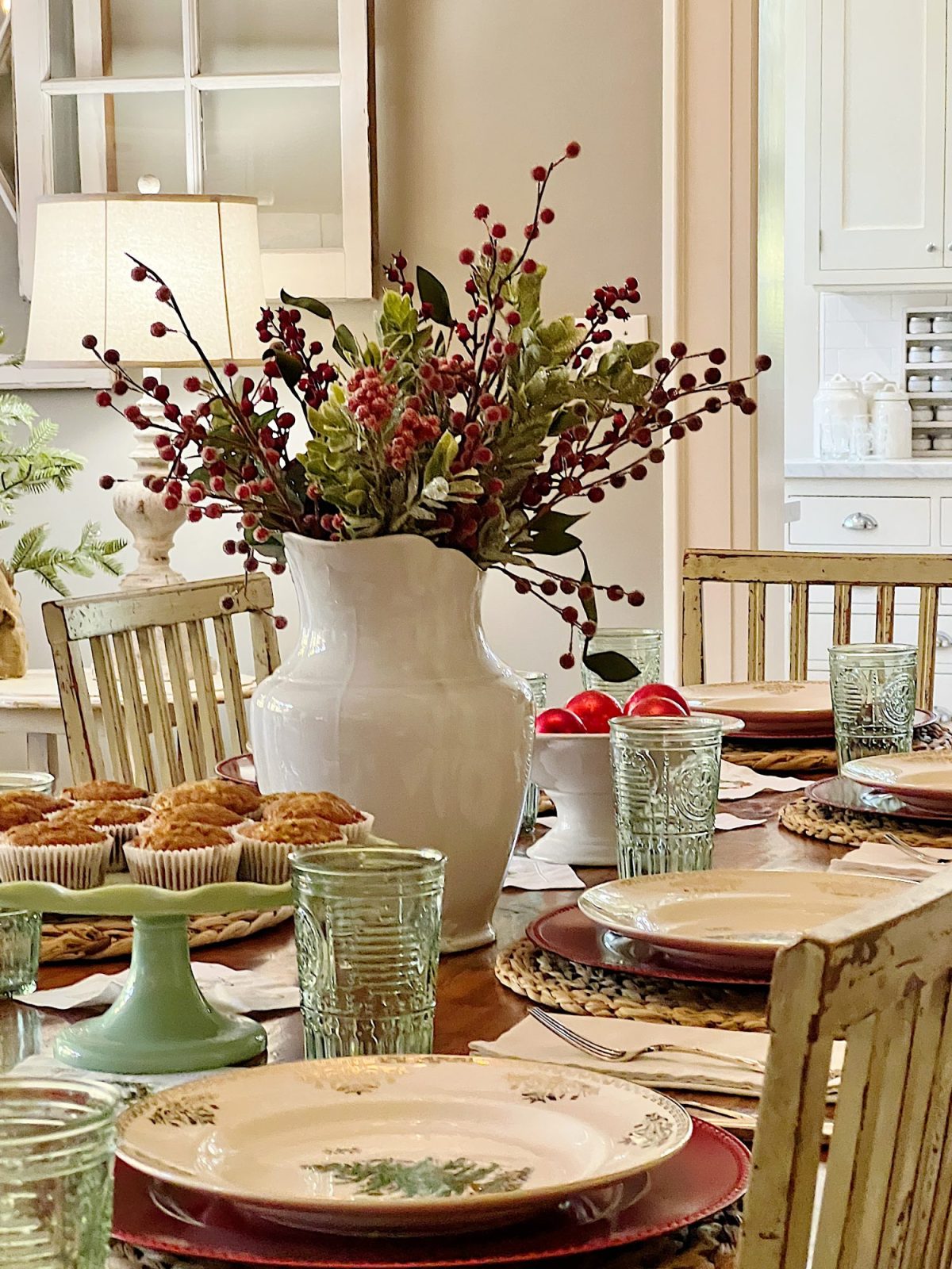 I decorated our family room with faux table top trees, bright colored Christmas balls, and a table set for Christmas morning breakfast.