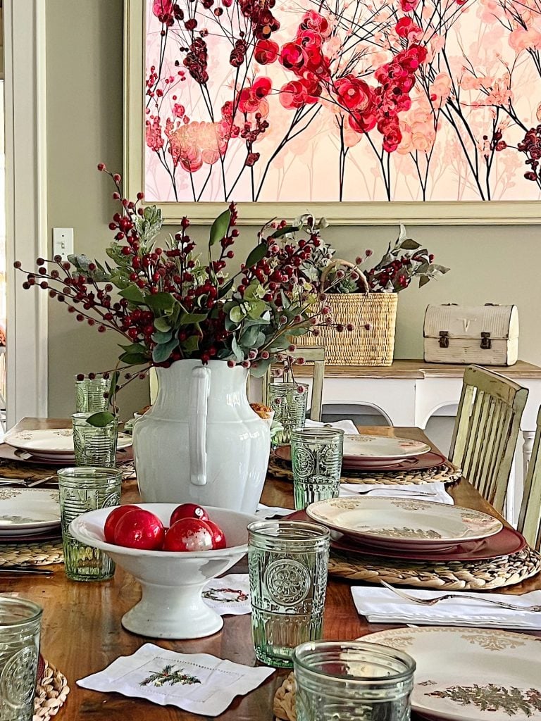 I decorated our family room with faux table top trees, bright colored Christmas balls, and a table set for Christmas morning breakfast.