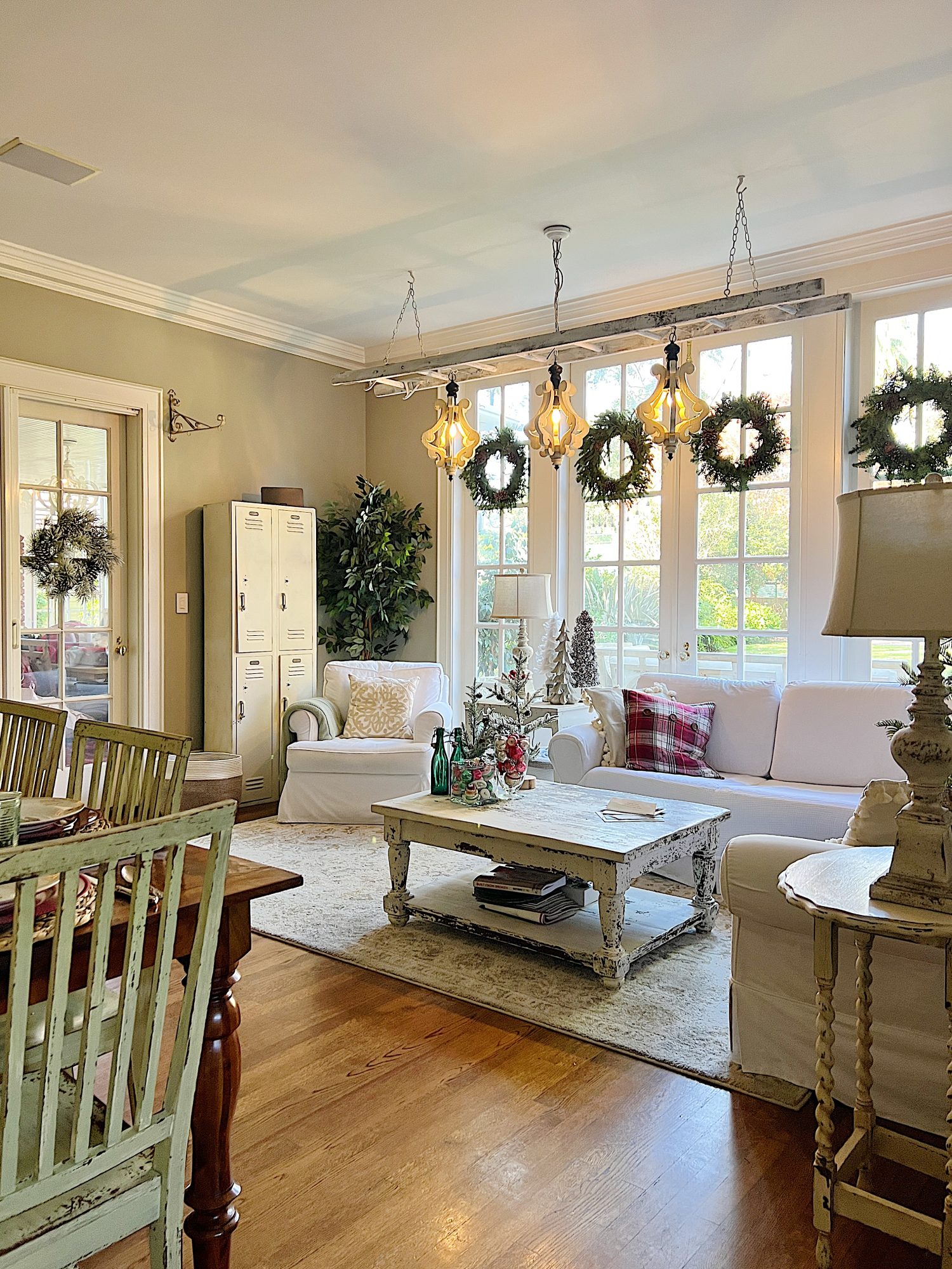 I decorated our family room with faux table top trees, bright colored Christmas balls, and a table set for Christmas morning breakfast.