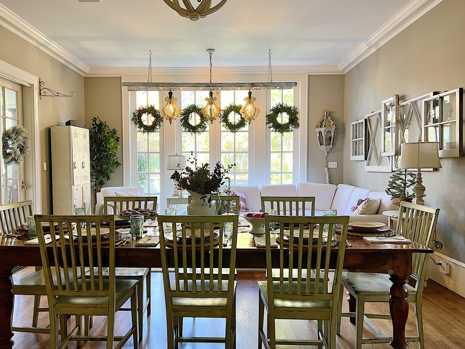 I decorated our family room with faux table top trees, bright colored Christmas balls, and a table set for Christmas morning breakfast.