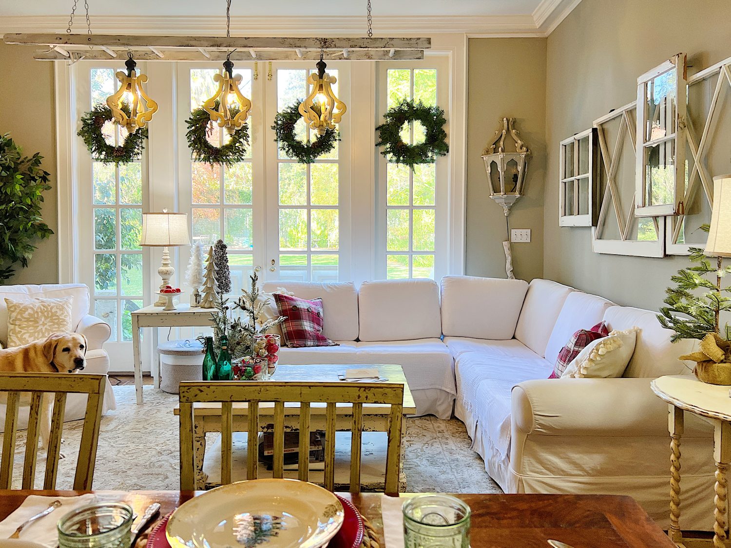 I decorated our family room with faux table top trees, bright colored Christmas balls, and a table set for Christmas morning breakfast.