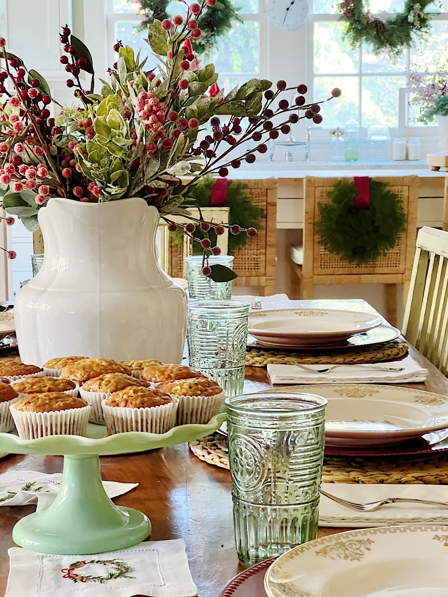 I decorated our family room with faux table top trees, bright colored Christmas balls, and a table set for Christmas morning breakfast.