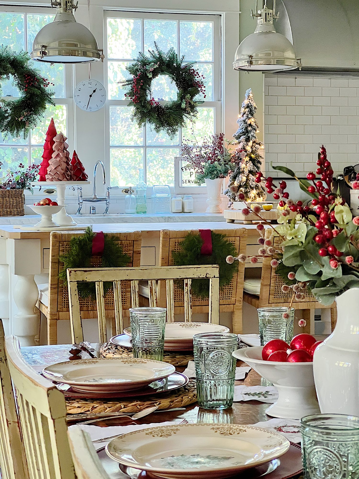 I decorated our family room with faux table top trees, bright colored Christmas balls, and a table set for Christmas morning breakfast.