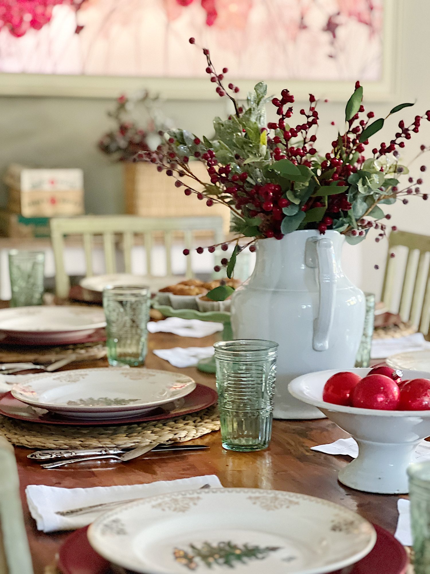 I decorated our family room with faux table top trees, bright colored Christmas balls, and a table set for Christmas morning breakfast.
