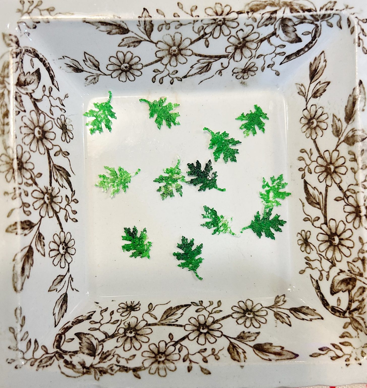Homemade sugar cookies with buttercream frosting decorated with wafer paper wreaths.