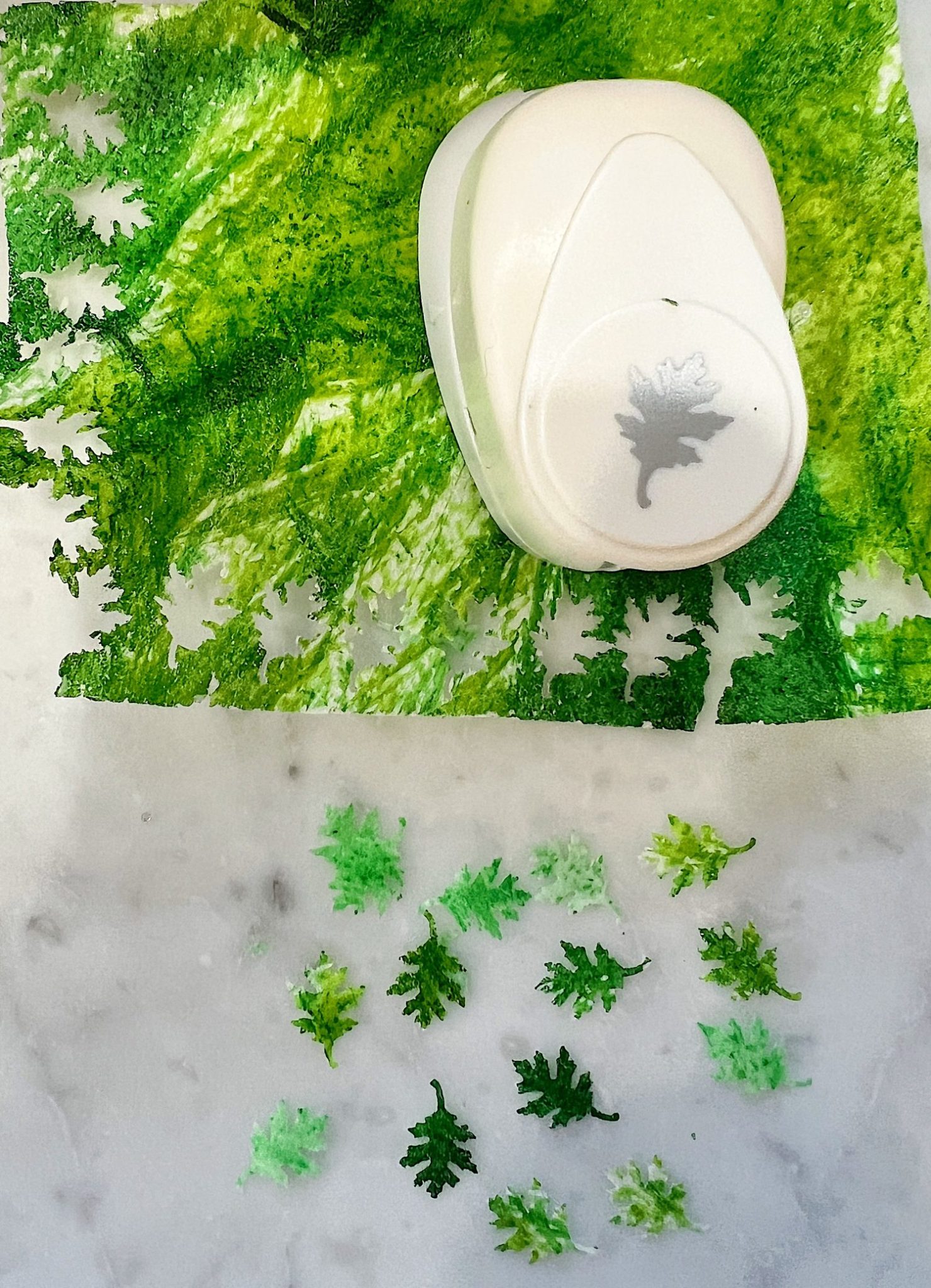 Homemade sugar cookies with buttercream frosting decorated with wafer paper wreaths.