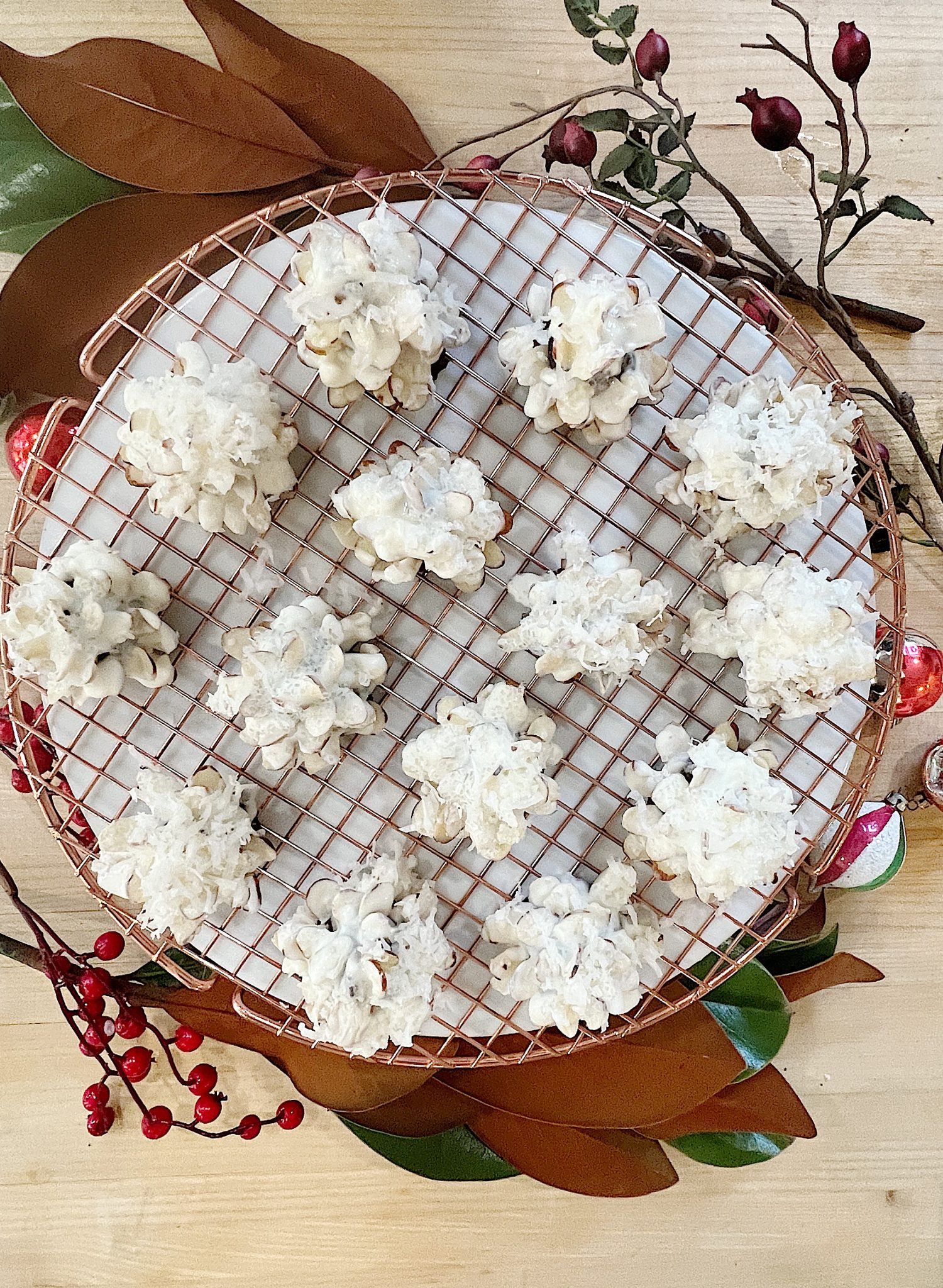 Homemade white chocolate covered brownie pinecones made from brownies, almonds, and melted chocolate.