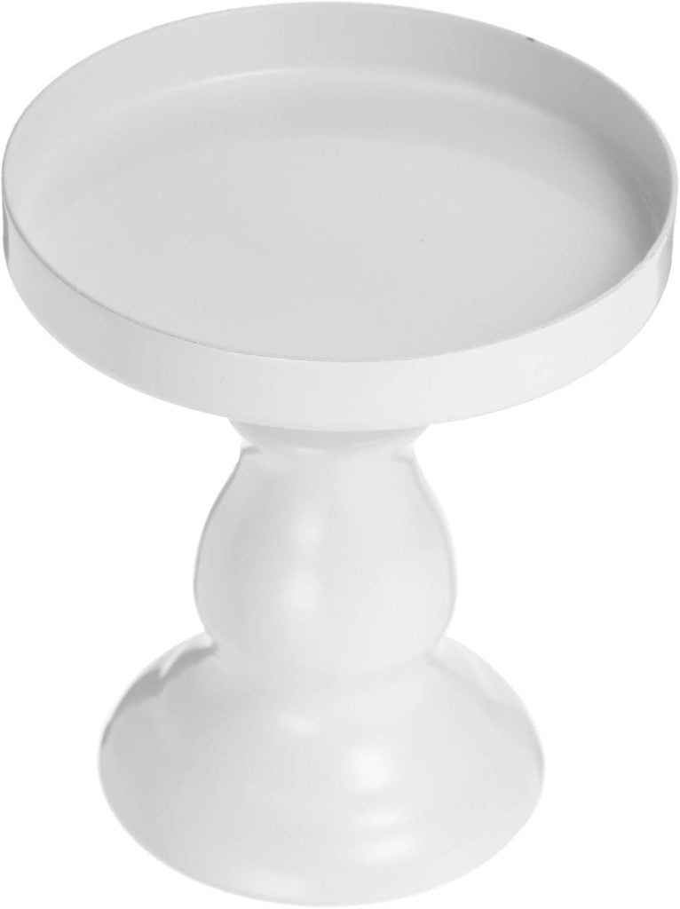 A small, white, round pedestal stand, perfect for a Valentine's Day charcuterie board, features a smooth finish and a solid base.