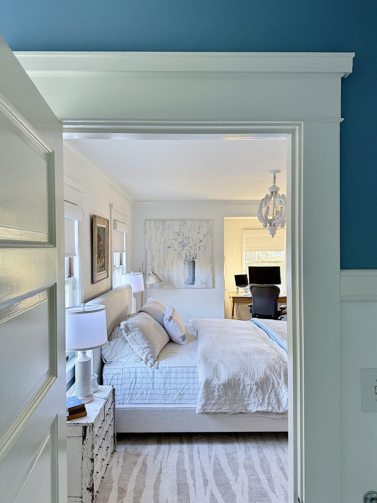 A bedroom makeover from two queens to a king and how to make the room well suited for guests.