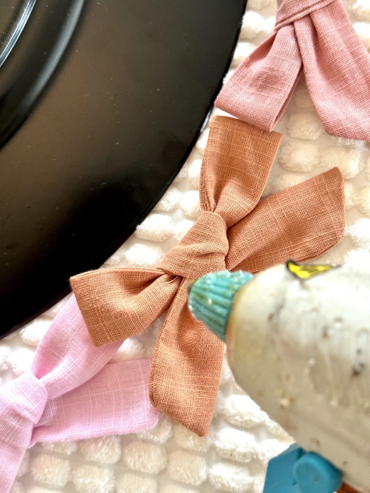 Ways to add bows to your home decor with pillows, art, and more.