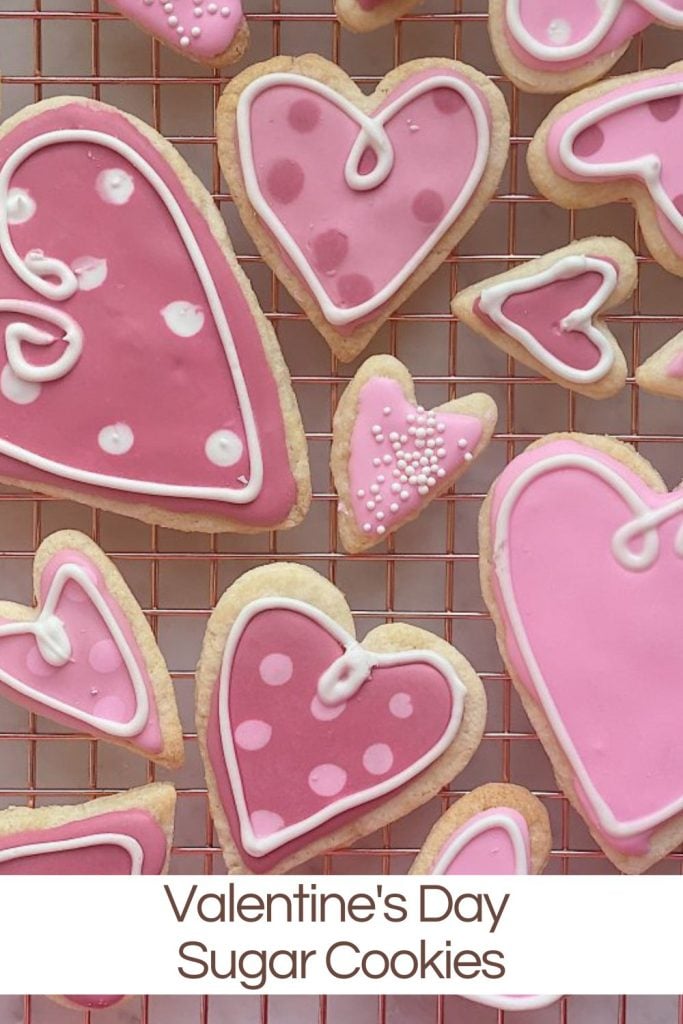 Homemade Valentine's heart shaped pink frosted sugar cookies.