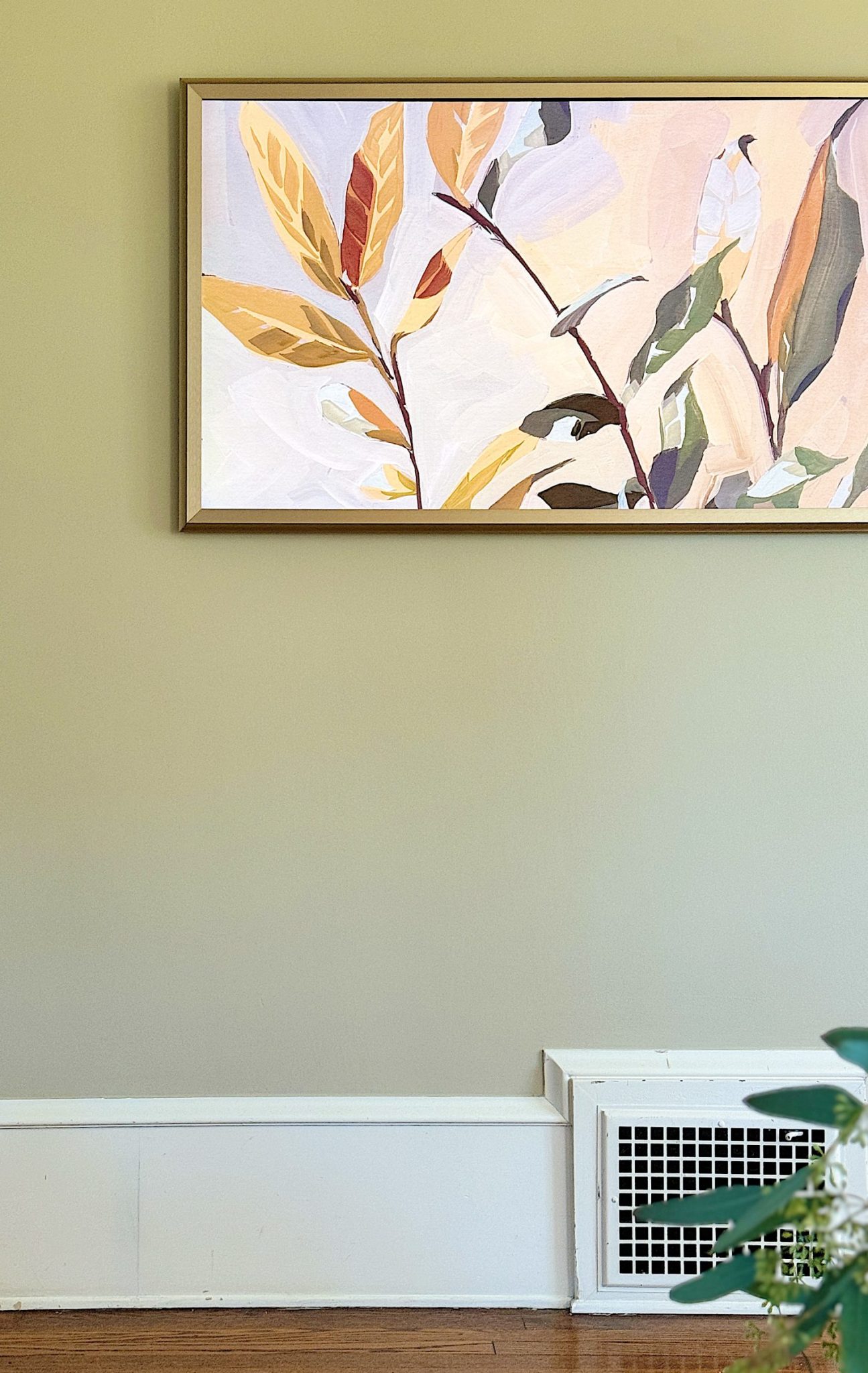 A redecorated living room with sage and taupe and a mix of new and vintage items.