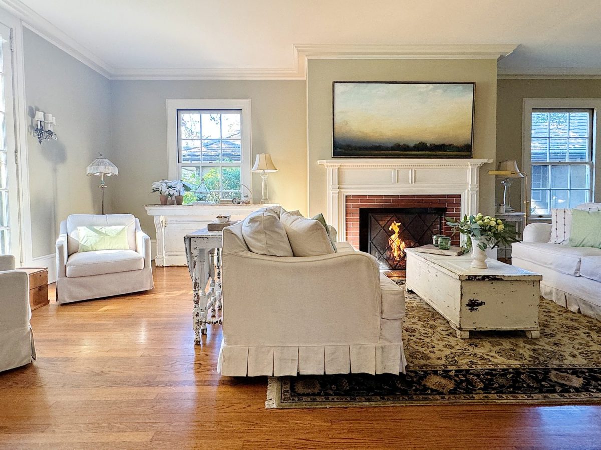 A redecorated living room with sage and taupe and a mix of new and vintage items.