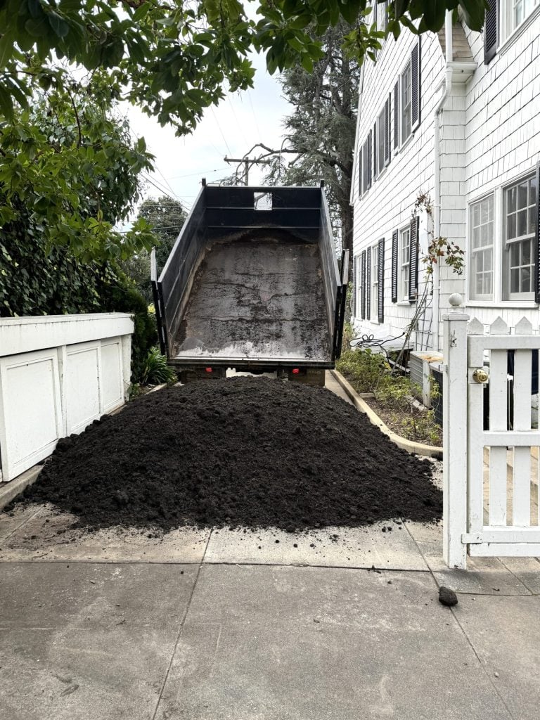 Vegetable garden soil getting delivered to our home.