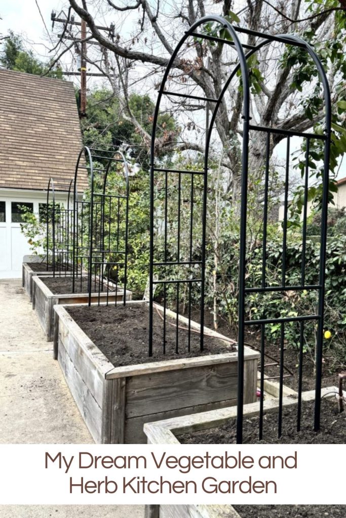 Four raised garden beds and three trellises installed.