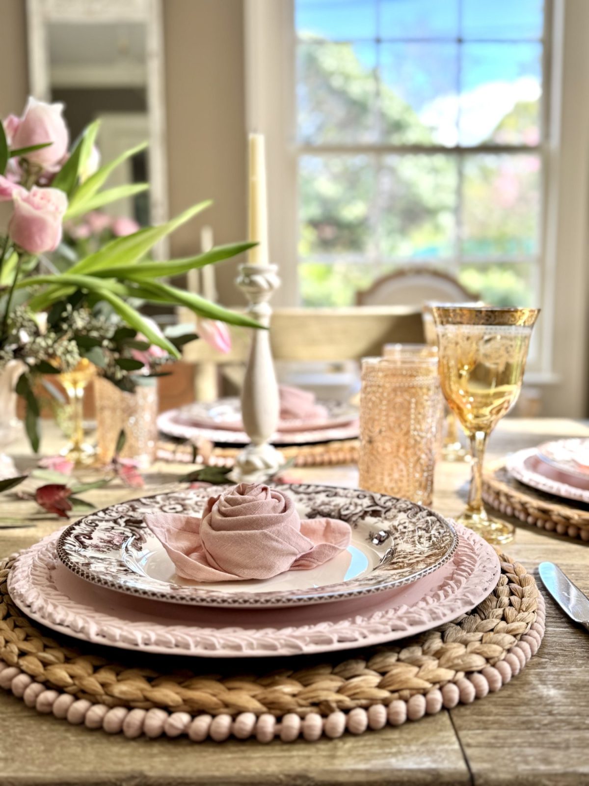 Light pink and tan neutral Valentine's Day Dining Room Table Decor with rosette napkins.
