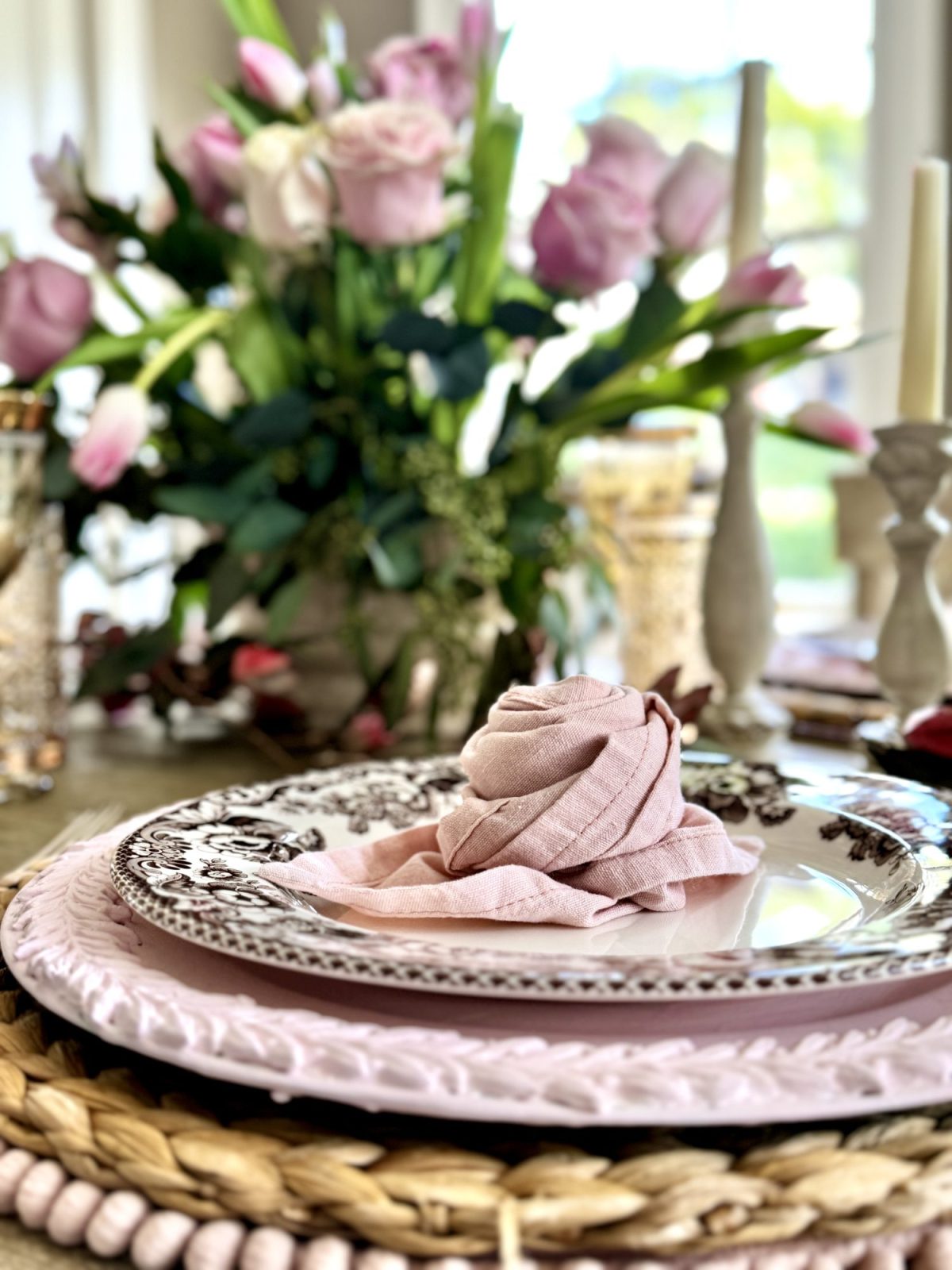 Light pink and tan neutral Valentine's Day Dining Room Table Decor with rosette napkins.