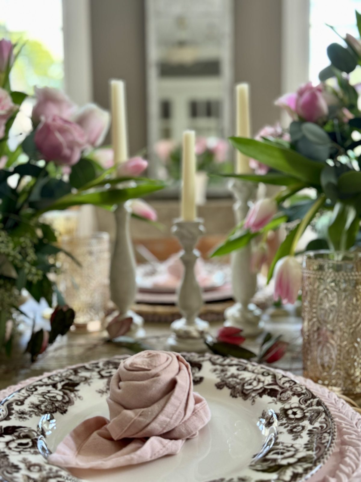 Light pink and tan neutral Valentine's Day Dining Room Table Decor with rosette napkins.