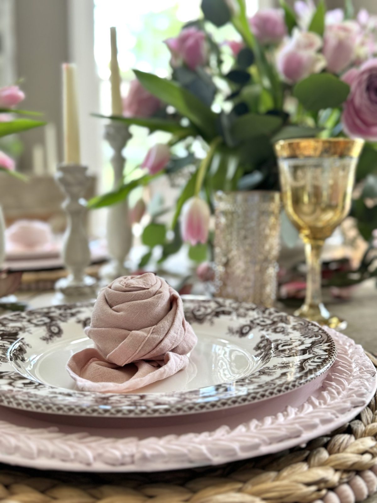 Light pink and tan neutral Valentine's Day Dining Room Table Decor with rosette napkins.