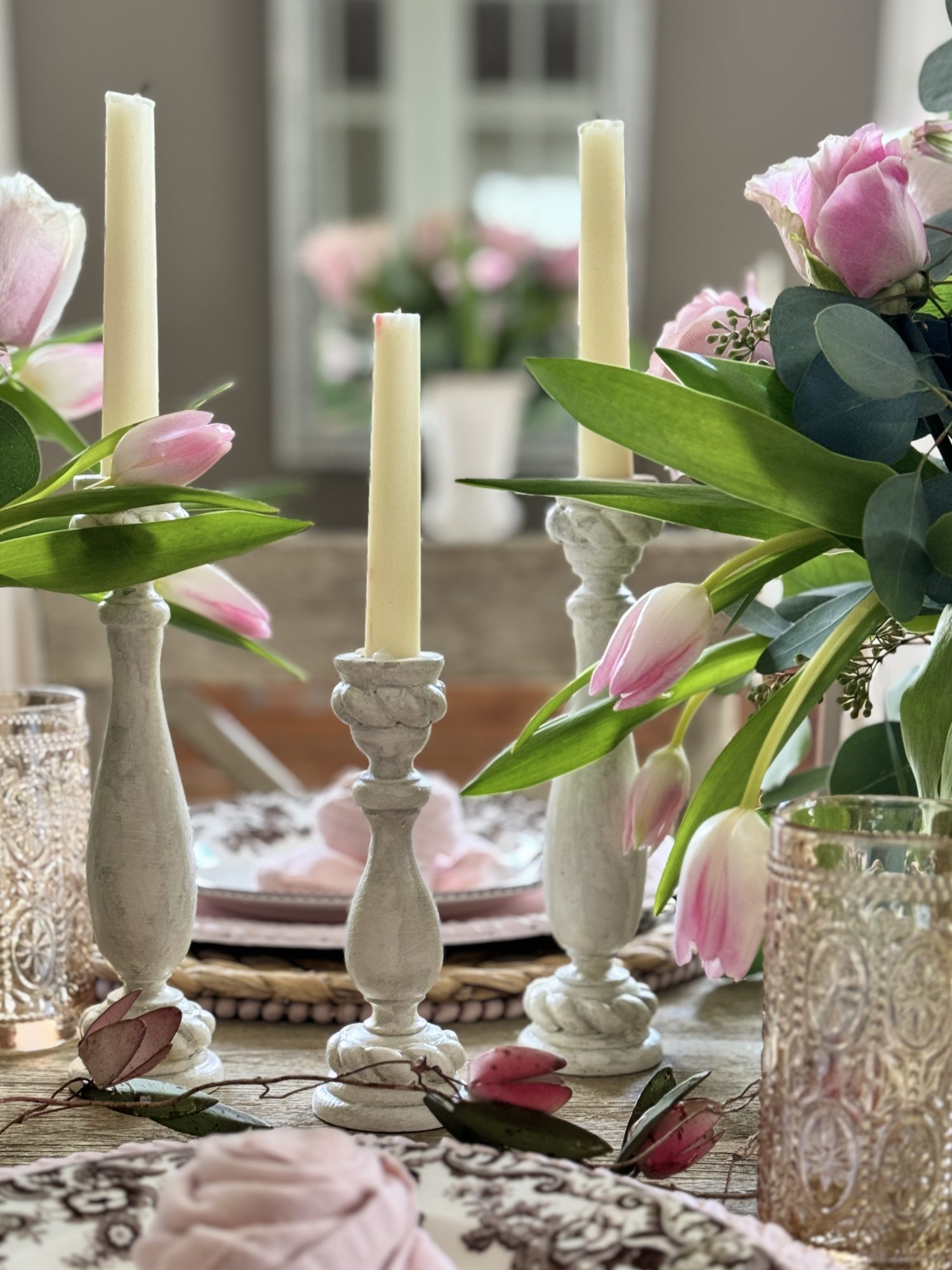 Light pink and tan neutral Valentine's Day Dining Room Table Decor with rosette napkins.
