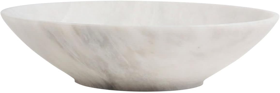 Vintage decor meets modern elegance with this marble bowl, showcasing a smooth, polished surface and a subtle, natural pattern in shades of gray and white.