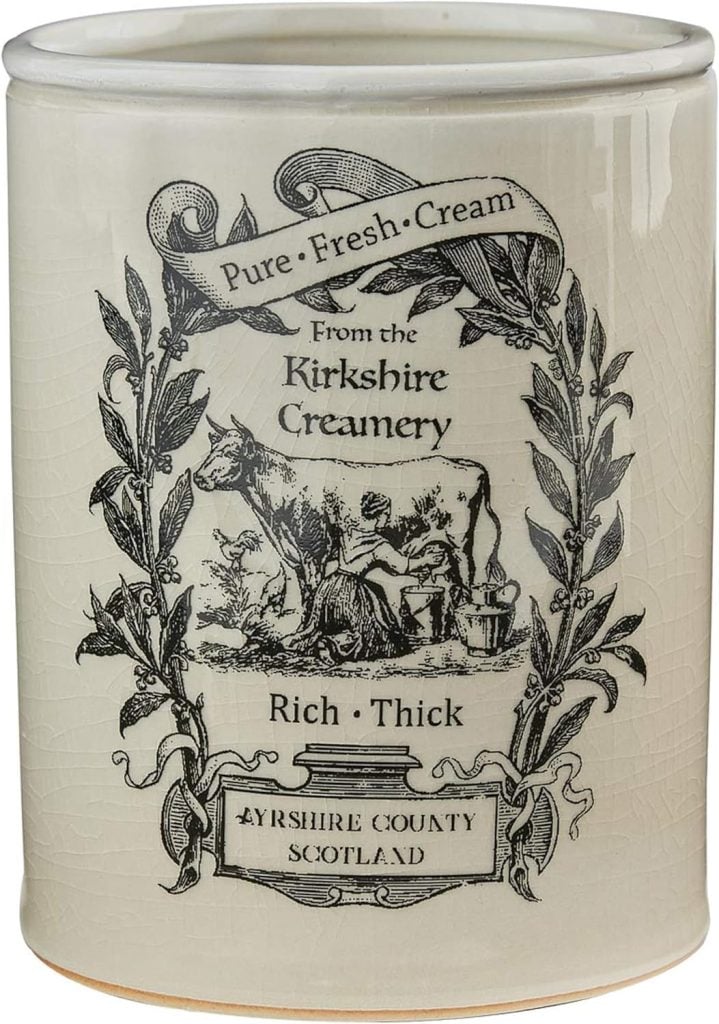 Vintage-style creamery canister with decorative spring floral arrangements label from Kirkshire Creamery, Ayrshire County, Scotland.