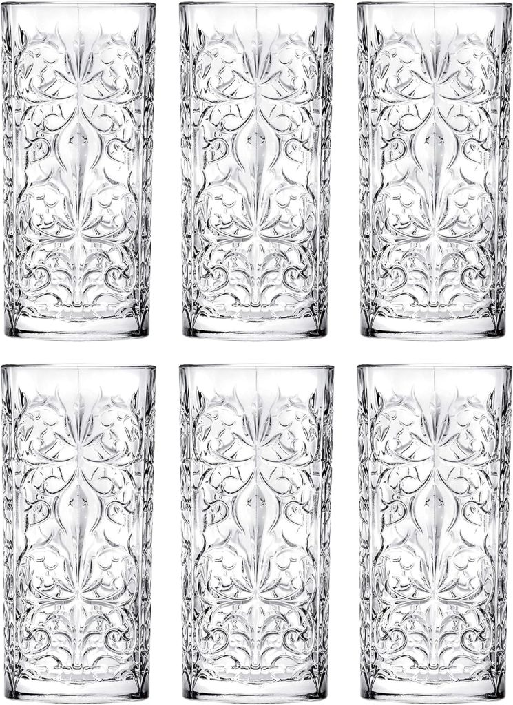 Set of six crystal highball glasses with ornate patterns, perfect for an outdoor party.