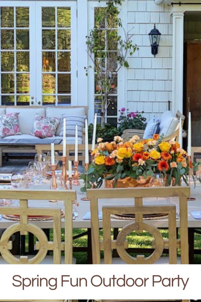 Elegant garden setting prepared for a spring outdoor party with a vibrant floral centerpiece.
