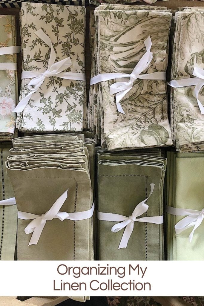 Folded linens arranged neatly and tied with white ribbons, with a caption reading "organizing my linen collection.