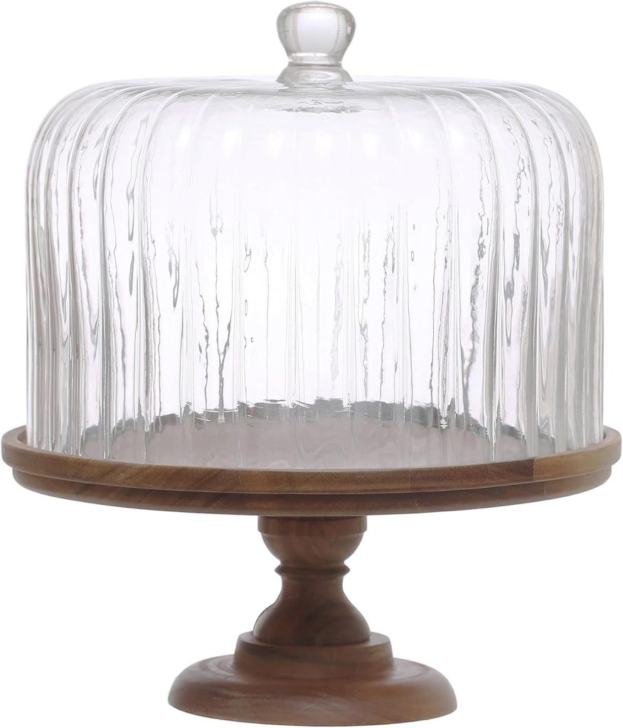 A wooden cake stand with a round base and a clear glass dome cover on top, perfect for displaying cakes decorated with edible paper designs.