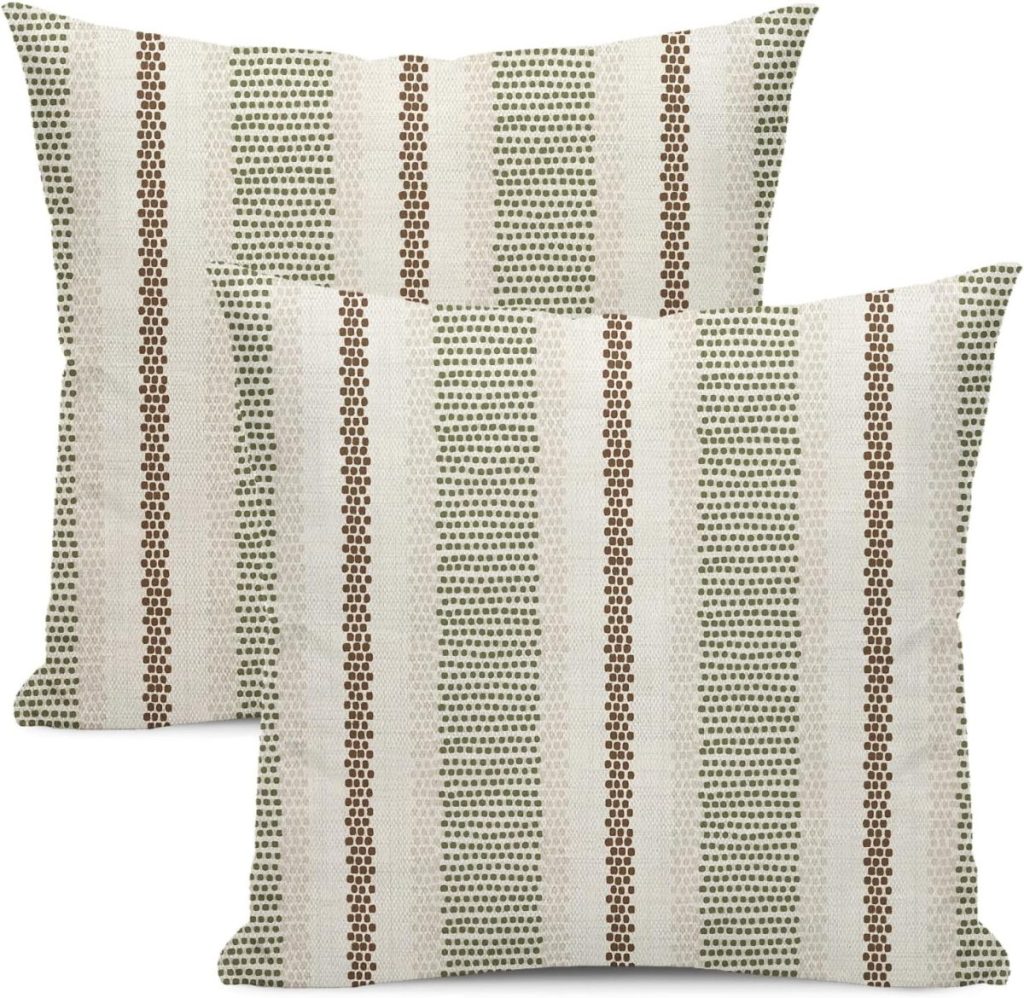 Two square throw pillows with a white background and vertical stripes in green and brown dot patterns, perfect for adding a fresh touch to your outdoor porch decor.