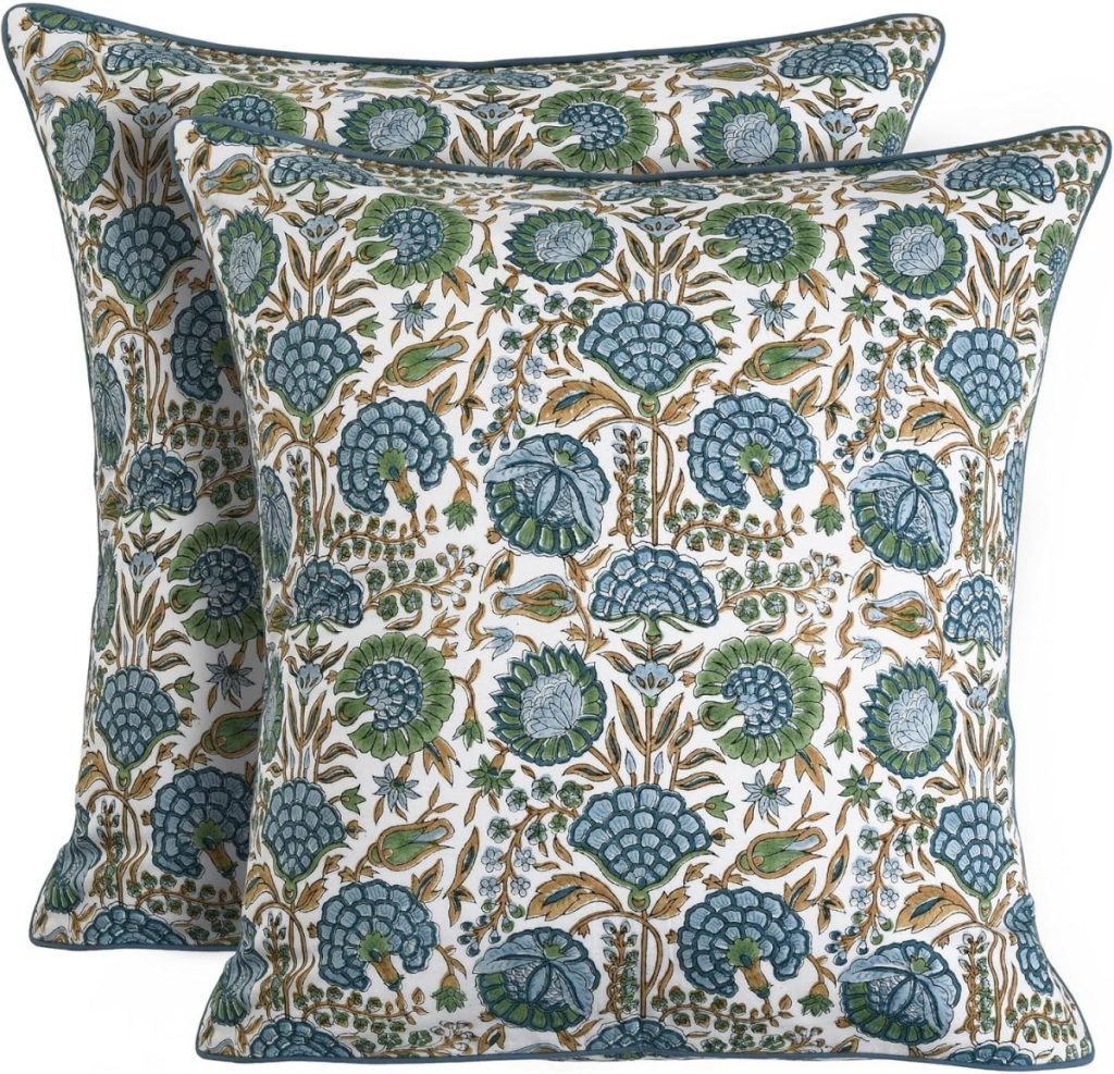 Two square decorative pillows with intricate floral and foliage patterns in shades of blue, green, and brown on a white background—perfect for adding charm to your outdoor porch decor.