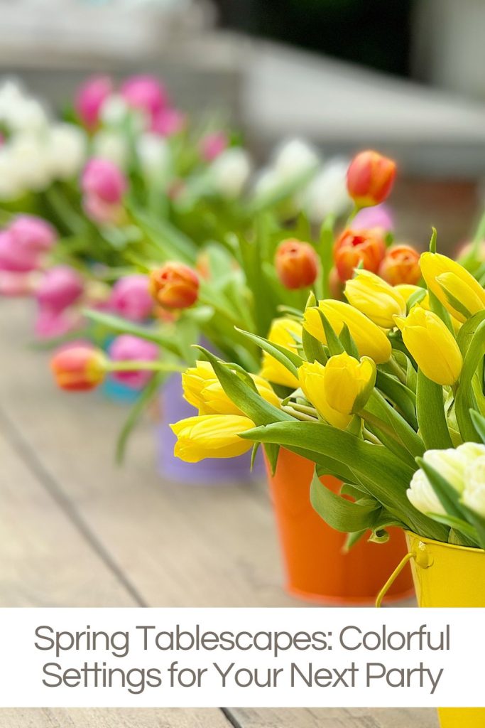 Colorful tulips in orange and yellow hues, arranged in bright buckets on a wooden table, with a focus on the foreground.