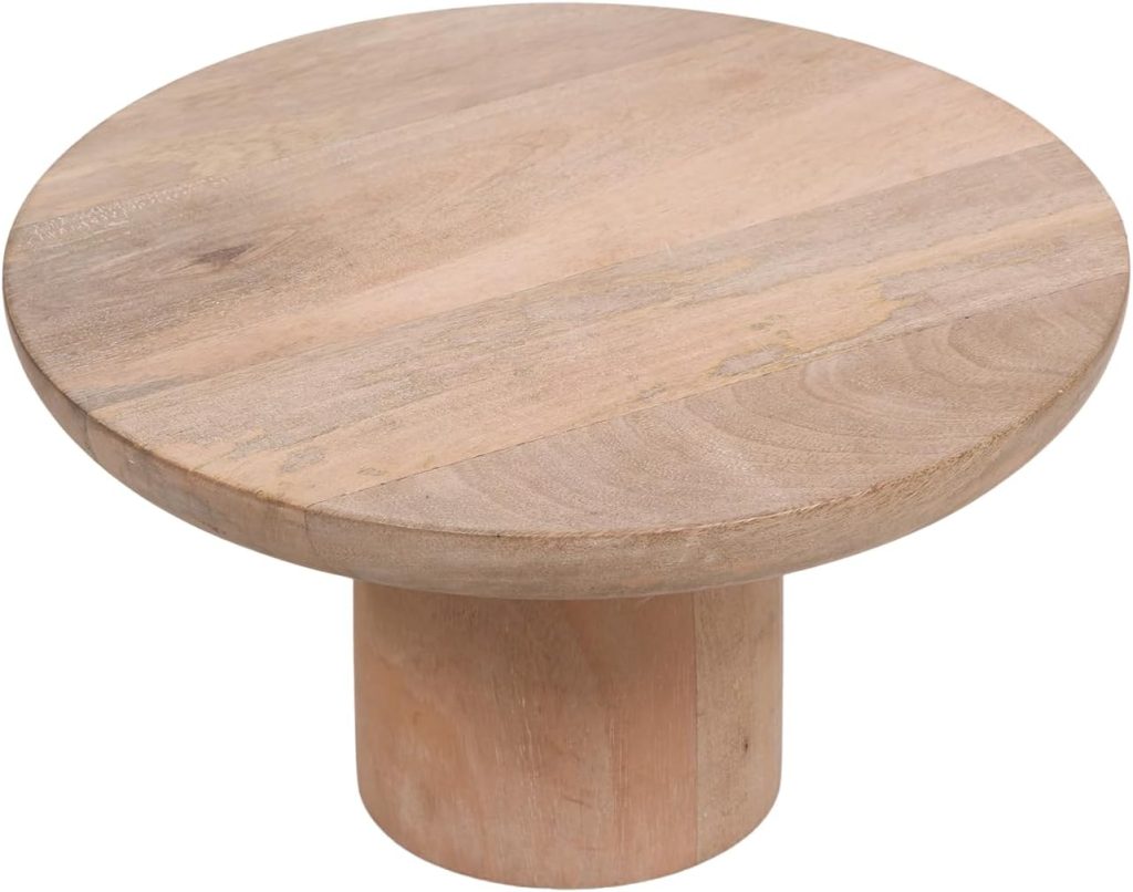 A round wooden pedestal stand with a thick cylindrical base, natural wood grain finish, and ideal for displaying paper clay sculptures.