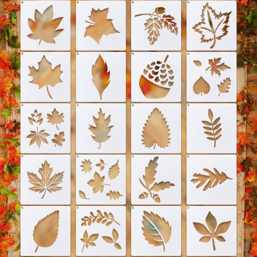 A grid of white stencil cards, each featuring a different leaf or acorn cutout design—perfect for decorating fall cookies—is displayed against a background decorated with autumn leaves.