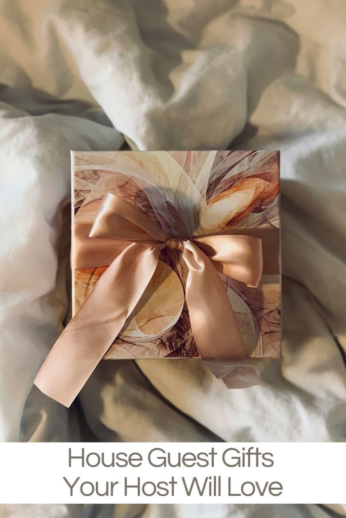 A wrapped gift box with a large pink bow, sitting on a bed. The text below reads, "House Guest Gifts Your Host Will Love.