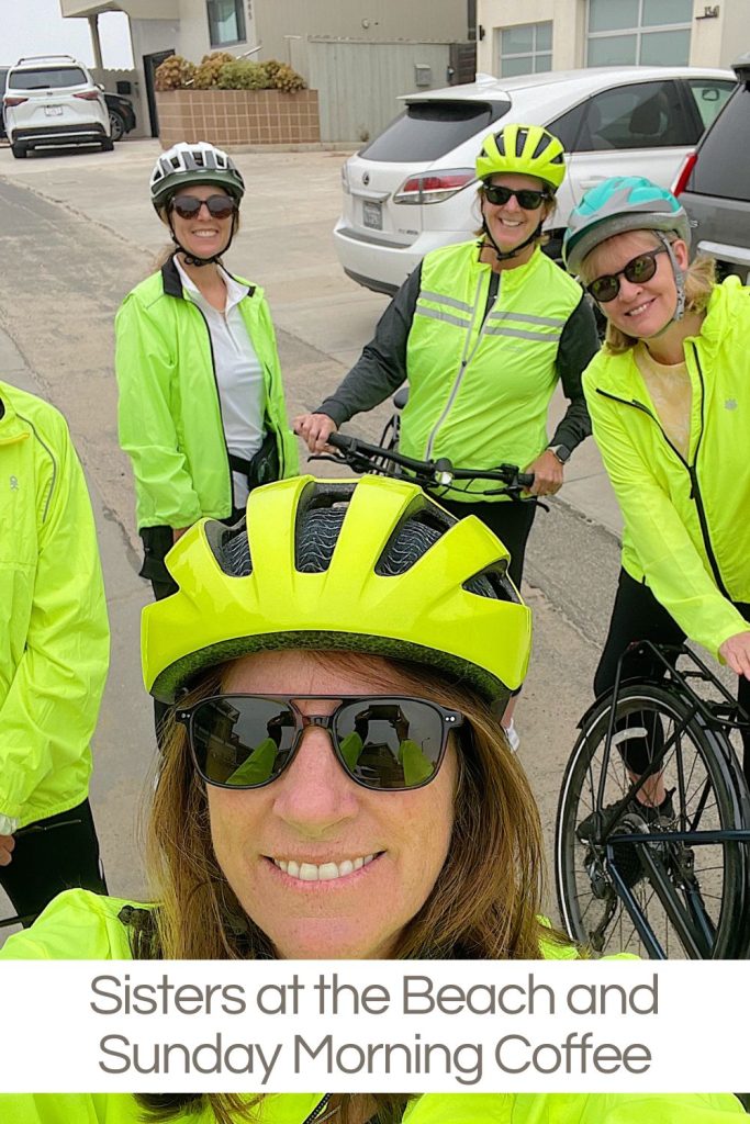 Four women in bright cycling gear pose with their bikes on a beachside road. Text at the bottom reads, "Sisters at the Beach and Sunday Morning Coffee.